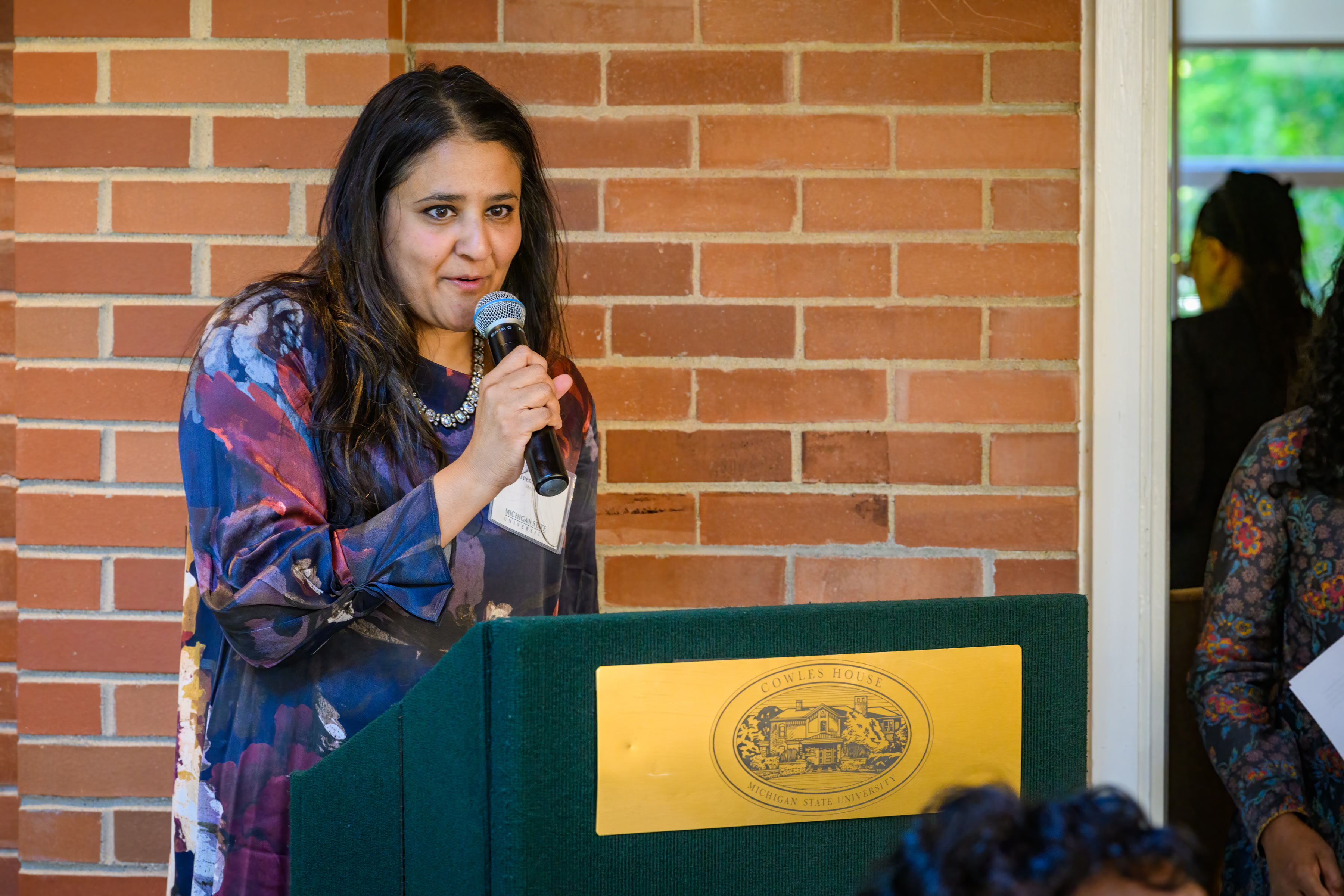 Shreena Gandhi, Ph.D., associate professor in the Department of Religious Studies and member of the Asian Pacific Islander Desi American/Asian Faculty Staff Association (ADIPA/AFSA) delivers the opening remarks.