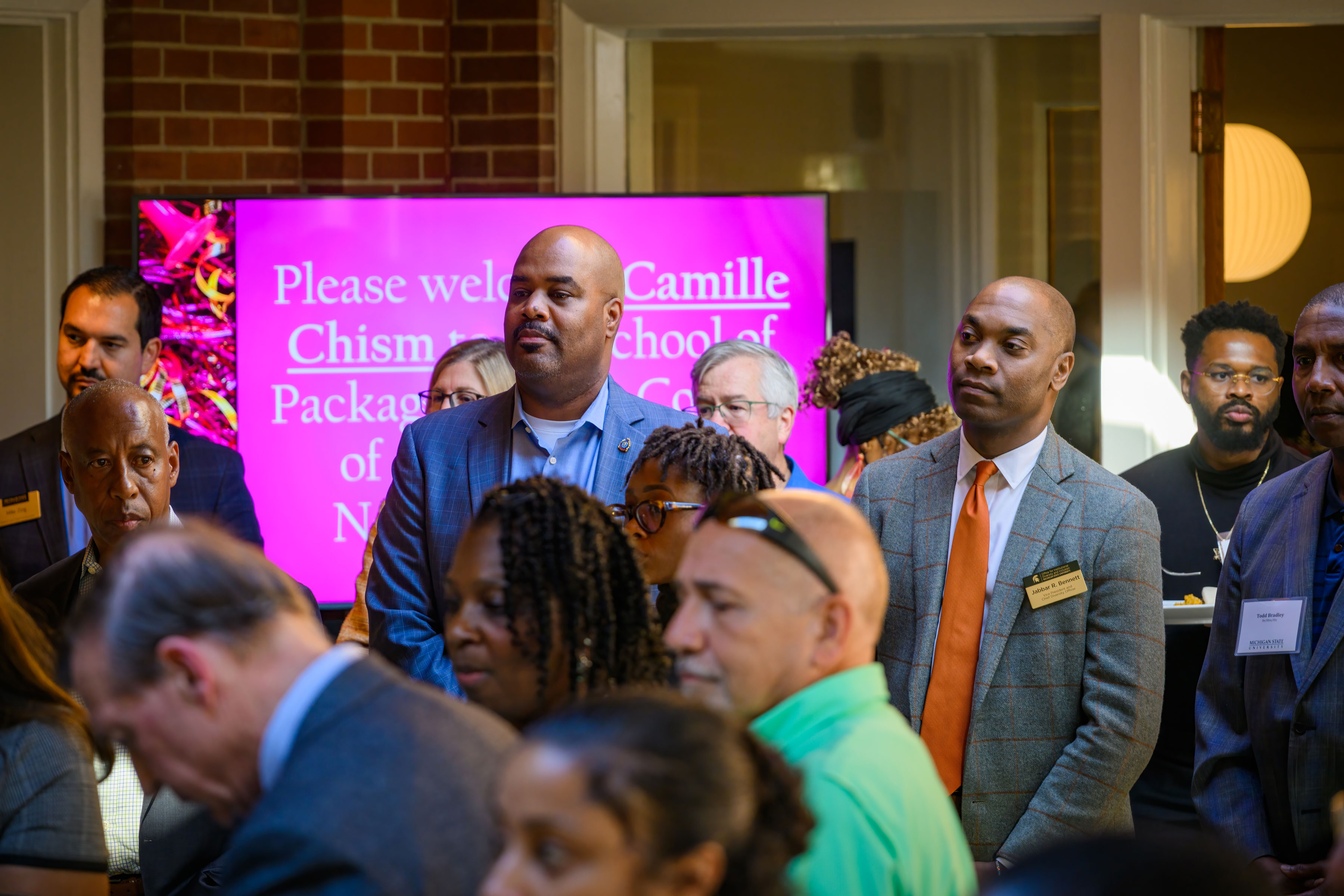 Vennie Gore (middle-left), senior vice president for Student Life and Engagement, Marlon C. Lynch (center), vice president for public safety and chief of police, and Jabbar R. Bennett, Ph.D. (middle-right), vice president and chief diversity officer look on.