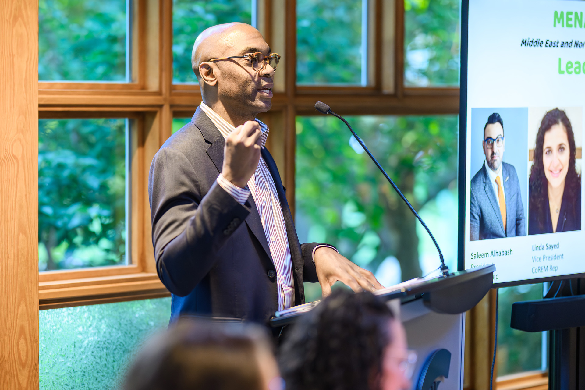 a man speaks at the lectern