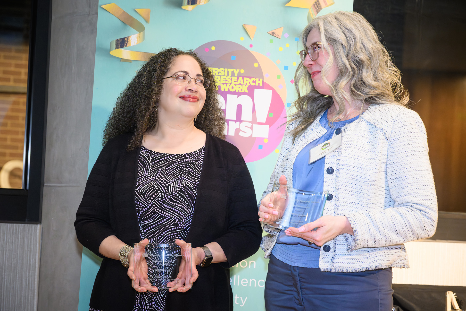 awardees pauses for a photo