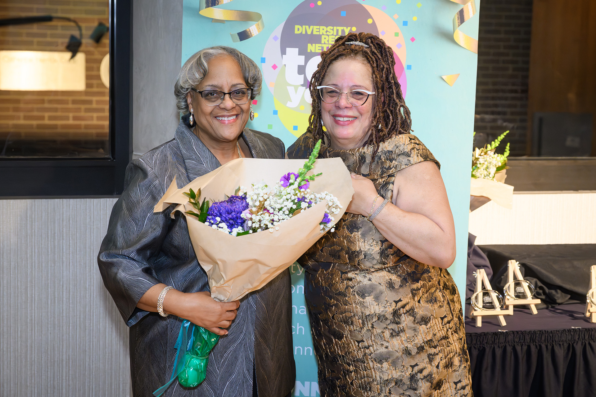 an awardee receives a bouquet