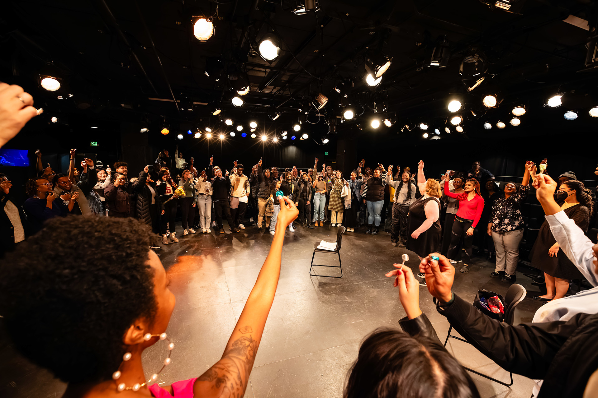 the audience joins all the performers in a toast using candy standing in a large circle and holding a piece of candy up