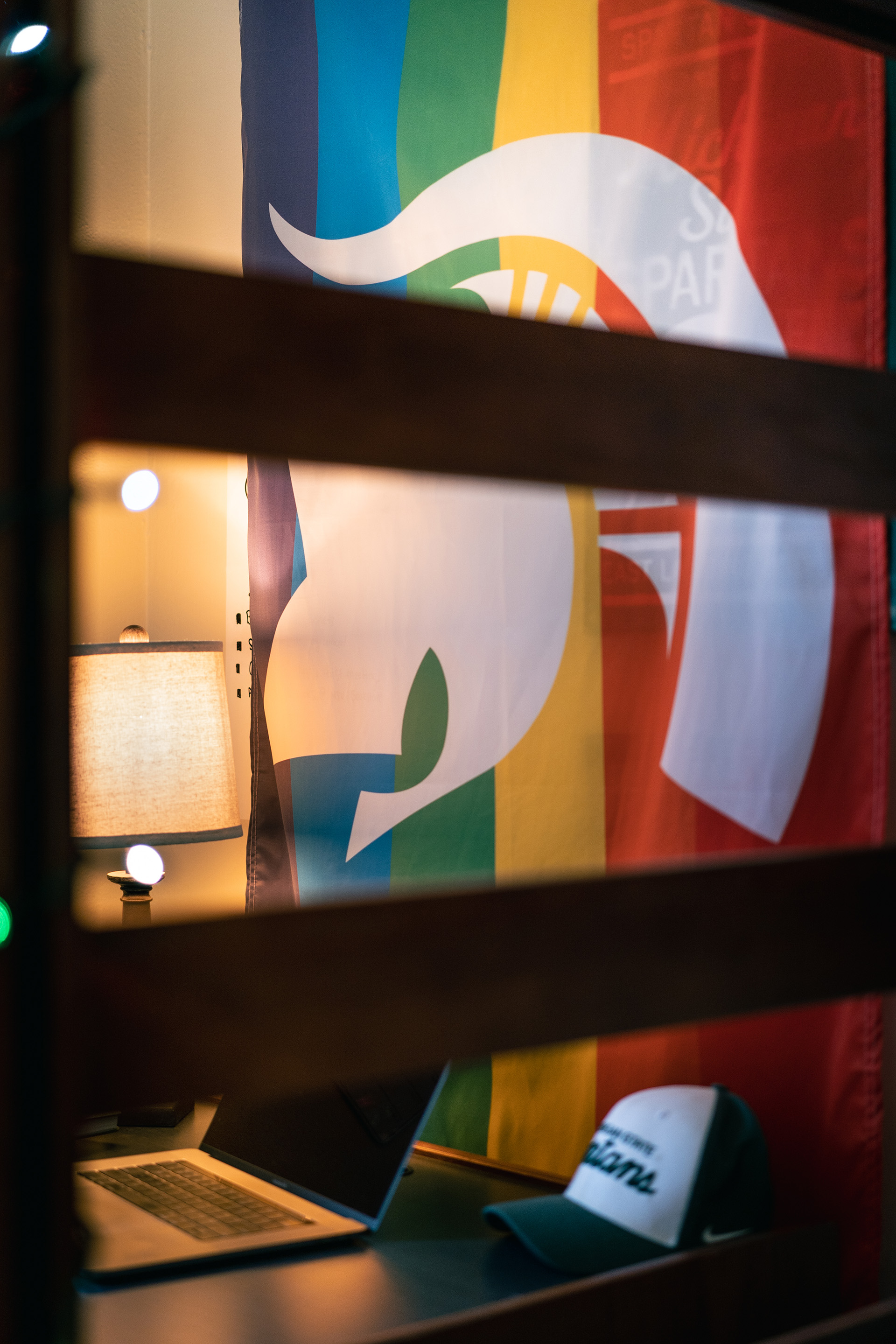 spartan pride flag visible through the bunk bed ladder slats