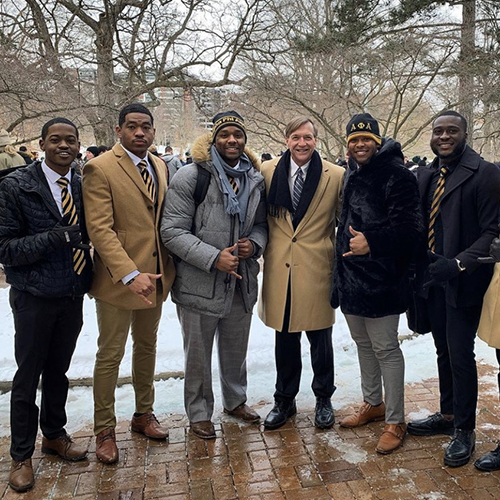 members of Alpha Phi Alpha Fraternity with President Stanley at a prior event