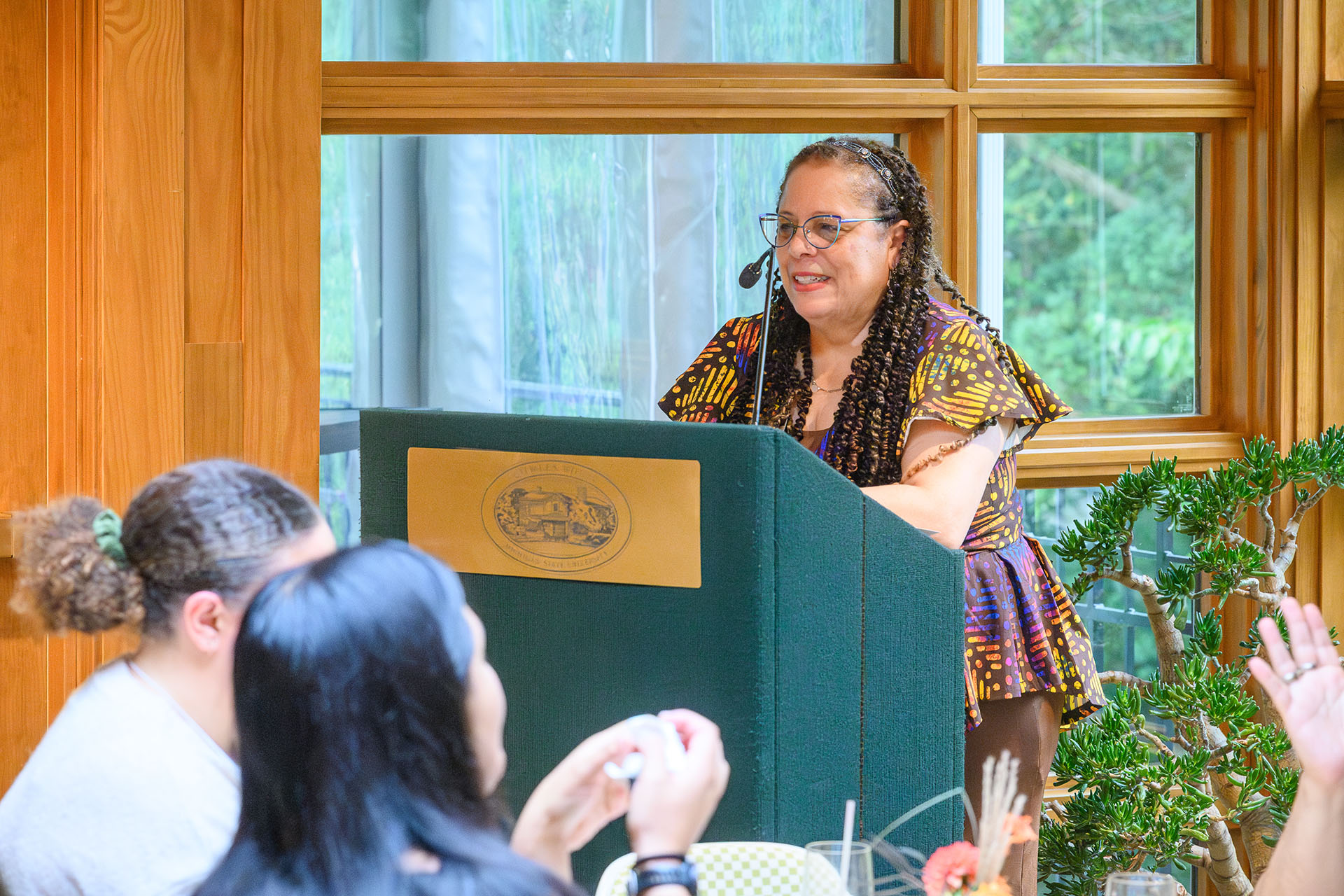 Deborah Johnson speaking at the lectern